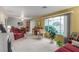 Inviting living room featuring a large window, plush seating, and charming decor at 768 Lawrence Dr, Henderson, NV 89015