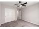 Neutral bedroom featuring a closet, doorways, and carpeted flooring at 7733 Rosebark Cliffs St, North Las Vegas, NV 89084