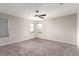 Bright bedroom featuring neutral walls, carpet, and a window that lets in natural light at 7733 Rosebark Cliffs St, North Las Vegas, NV 89084