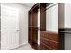 Walk-in closet featuring custom shelving and drawers for organized storage at 7733 Rosebark Cliffs St, North Las Vegas, NV 89084