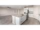 Modern kitchen with a large island, stainless steel appliances, and ample counter space at 7733 Rosebark Cliffs St, North Las Vegas, NV 89084