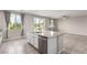 Bright, spacious kitchen with a central island, stainless steel dishwasher and backyard access at 7733 Rosebark Cliffs St, North Las Vegas, NV 89084