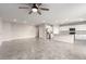 Expansive living room featuring tile flooring, recessed lighting, and an open layout at 7733 Rosebark Cliffs St, North Las Vegas, NV 89084