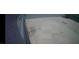 Top-down view of barren backyard with gray block wall fence at 8116 Russell Creek Ct, Las Vegas, NV 89139