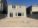 Spacious backyard with dirt landscaping, gray fence, and two-story gray house at 8116 Russell Creek Ct, Las Vegas, NV 89139