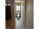 Bathroom with neutral tile flooring featuring a toilet and shower with granite look surround at 8116 Russell Creek Ct, Las Vegas, NV 89139