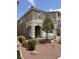 Charming two-story home featuring a two-car garage, arched entryway, and well-maintained landscaping at 8116 Russell Creek Ct, Las Vegas, NV 89139