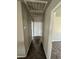Neutral hallway featuring carpeting, painted walls, and bright white trim at 8116 Russell Creek Ct, Las Vegas, NV 89139