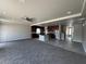 Open living room with adjacent kitchen featuring an island and stainless steel appliances at 8116 Russell Creek Ct, Las Vegas, NV 89139