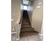 Carpeted staircase with a handrail, leading to the upper level of the home at 8116 Russell Creek Ct, Las Vegas, NV 89139