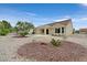 Low-maintenance backyard features desert landscaping and mature landscaping at 8513 Festival Dr, Las Vegas, NV 89134