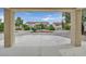 View of the backyard landscaped with desert plants, and a covered patio at 8513 Festival Dr, Las Vegas, NV 89134