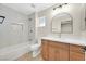 Updated bathroom featuring a single vanity, stylish fixtures, and shower-tub combo with tile at 8513 Festival Dr, Las Vegas, NV 89134