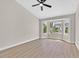 Spacious bedroom features a vaulted ceiling, large bay window, and light wood-look floors at 8513 Festival Dr, Las Vegas, NV 89134