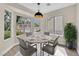 Bright dining area with a modern light fixture and views of the surrounding neighborhood at 8513 Festival Dr, Las Vegas, NV 89134