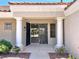 Inviting front entrance with decorative security door, tile roof, and stately columns at 8513 Festival Dr, Las Vegas, NV 89134