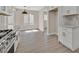 Well-appointed kitchen with stainless steel range, white cabinetry, and ample counter space at 8513 Festival Dr, Las Vegas, NV 89134