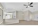 Open-concept living area with wood-look floors and a breakfast bar, offering a seamless transition to the dining space at 8513 Festival Dr, Las Vegas, NV 89134