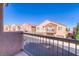 View of street from balcony with railing, showcasing modern homes at 8717 Tom Noon Ave # 101, Las Vegas, NV 89178