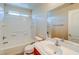 Bright bathroom features a shower-tub combo and a vanity with mirror at 8717 Tom Noon Ave # 101, Las Vegas, NV 89178