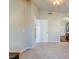 Bedroom features neutral carpet, bathroom access, and light ceiling fan at 8717 Tom Noon Ave # 101, Las Vegas, NV 89178