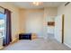 Carpeted bedroom featuring neutral walls, modern lighting and a window providing natural light at 8717 Tom Noon Ave # 101, Las Vegas, NV 89178
