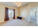 Spacious carpeted bedroom with a window for natural light and an open doorway at 8717 Tom Noon Ave # 101, Las Vegas, NV 89178