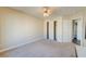 Bedroom with neutral carpet, closet and ceiling fan at 8717 Tom Noon Ave # 101, Las Vegas, NV 89178