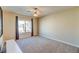 Spacious bedroom with neutral carpeting, cream walls, and ample natural light at 8717 Tom Noon Ave # 101, Las Vegas, NV 89178