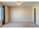 Bedroom features neutral carpet, a ceiling fan, and a window with curtains at 8717 Tom Noon Ave # 101, Las Vegas, NV 89178