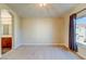 Bright bedroom with carpet, natural light, and ensuite bathroom access at 8717 Tom Noon Ave # 101, Las Vegas, NV 89178