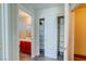 Hallway featuring bathroom and closet with wood-look flooring at 8717 Tom Noon Ave # 101, Las Vegas, NV 89178
