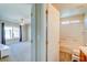 Hallway featuring view to bathroom and bedroom at 8717 Tom Noon Ave # 101, Las Vegas, NV 89178