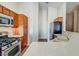 Bright kitchen featuring stainless steel appliances, plenty of counter space, and abundant storage in wooden cabinets at 8717 Tom Noon Ave # 101, Las Vegas, NV 89178
