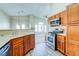 Well-equipped kitchen with stainless steel appliances, wood cabinets, and an open layout perfect for entertaining at 8717 Tom Noon Ave # 101, Las Vegas, NV 89178
