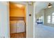 Convenient laundry room with washer/dryer; entryway shows view to living room with fireplace at 8717 Tom Noon Ave # 101, Las Vegas, NV 89178