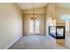 Inviting living room with cozy fireplace, neutral carpet, and sliding glass doors for seamless indoor-outdoor living at 8717 Tom Noon Ave # 101, Las Vegas, NV 89178