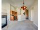 Living room with fireplace, open kitchen, and neutral carpeting at 8717 Tom Noon Ave # 101, Las Vegas, NV 89178