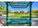Community park picnic bench and view of grassy green space with shady trees at 8717 Tom Noon Ave # 101, Las Vegas, NV 89178