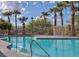 Enjoy swimming in the community pool, perfect for cooling off on a hot day, surrounded by palm trees at 8717 Tom Noon Ave # 101, Las Vegas, NV 89178