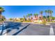 Street view of the Arlington Ranch community showcases desert landscaping and multiple homes on a clear day at 8717 Tom Noon Ave # 101, Las Vegas, NV 89178