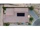 Aerial view of the home's roof, featuring solar panels, landscaping, and driveway at 9570 Thistle Creek Ave, Las Vegas, NV 89178