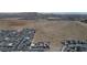 An aerial view of the community, desert landscape, and surrounding homes at 9570 Thistle Creek Ave, Las Vegas, NV 89178