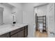 Updated bathroom features double sinks and a separate shower and toilet area at 9570 Thistle Creek Ave, Las Vegas, NV 89178