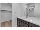Bathroom featuring a modern vanity with sink and access to the walk-in closet at 9570 Thistle Creek Ave, Las Vegas, NV 89178