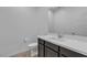 Modern bathroom features a sleek vanity, quartz countertop, and updated fixtures at 9570 Thistle Creek Ave, Las Vegas, NV 89178