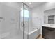 Contemporary bathroom with a glass-enclosed shower, soaking tub, and sleek vanity at 9570 Thistle Creek Ave, Las Vegas, NV 89178
