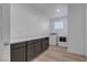 Convenient laundry room with storage cabinets, countertop, washer, and dryer at 9570 Thistle Creek Ave, Las Vegas, NV 89178