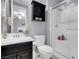 Bathroom featuring vanity, mirror, toilet and glass enclosed shower at 9654 Starfish Reef Way, Las Vegas, NV 89178