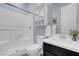 Modern bathroom featuring a glass enclosed shower with white subway tile and a stylish vanity at 9654 Starfish Reef Way, Las Vegas, NV 89178